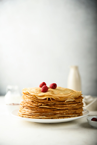 Traditional homemade crepes on a white plate
