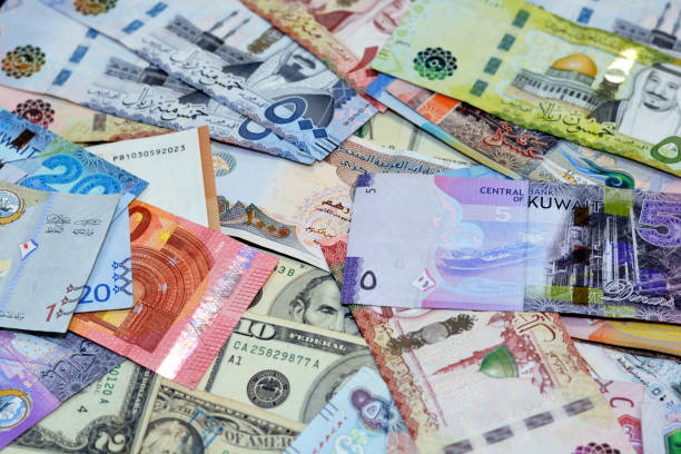 background of money banknotes from different countries of the world, american dollars money, saudi riyals, kuwaiti dinars, emirates dirhams and european euros - gulfstaterna bildbanksfoton och bilder