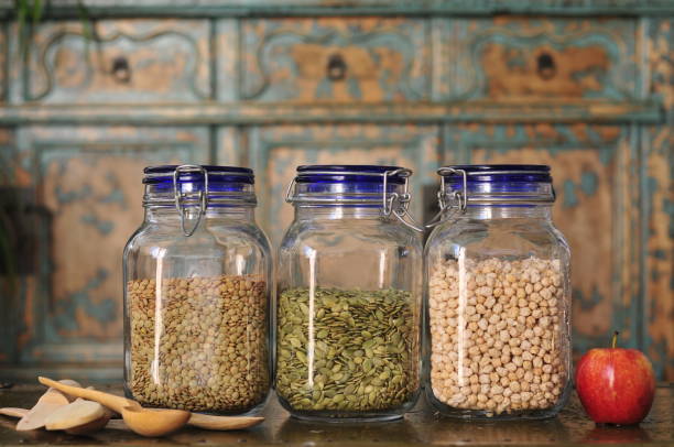 istock Lentils, pumpkin seeds, chickpeas in jars 1360804299