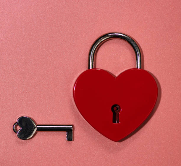 istock padlock red heart with key on background with bokeh 1360805077