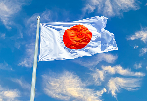 Japanese state flag waving on the wind against the sky