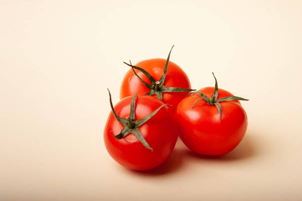 istock three red fresh tomatoes. Vegetables. Healthy eating concept 1360809809