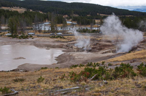 Mud Volcano Area in Yellowstone National Park in Wyoming in the USA Mud Volcano Area in Yellowstone National Park in Wyoming in the USA mud volcano yellowstone stock pictures, royalty-free photos & images