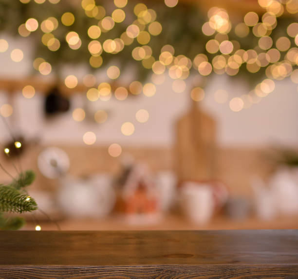 istock Christmas background. Empty wooden board on blurred Christmas kitchen background and golden bokeh.. Ready for product montage. Banner. Copy space. 1360815531