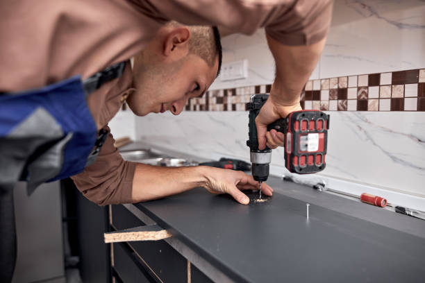 istock Handyman making kitchen wall cabinets in the apartment. 1360818568