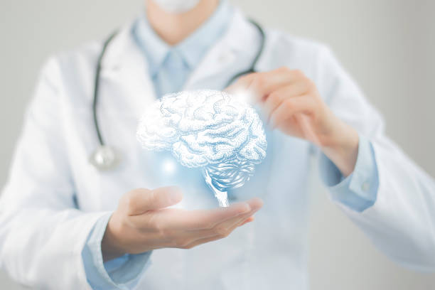 Unrecognizable doctor holding highlighted handrawn Brain in hands. Medical illustration, template, science mockup. Female doctor holding virtual volumetric drawing of  Brain in hand. Handrawn human organ, copy space on right side, raw photo colors. Healthcare hospital service concept stock photo dementia stock pictures, royalty-free photos & images