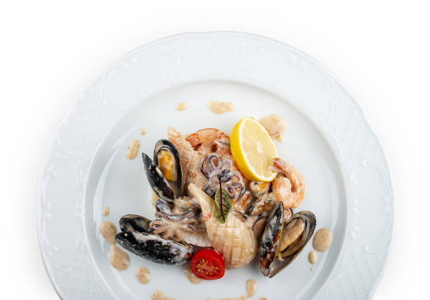 Rice with seafood: shrimp, squid and mussels. Isolated on a white background.