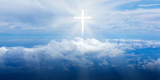 istock Christian cross appears bright 1360822450