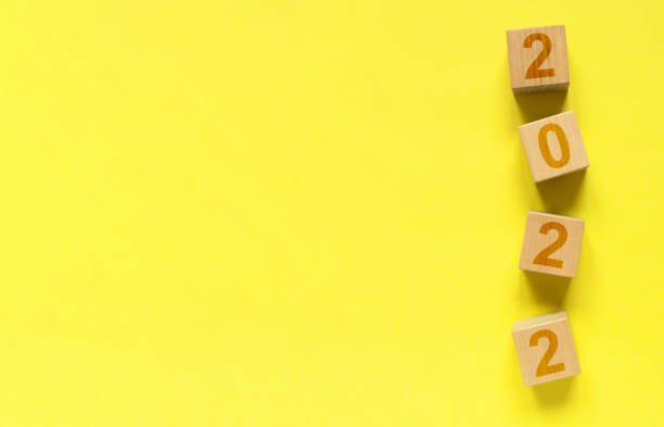 istock 2022 year banner with copy space for text on yellow background 1360824420