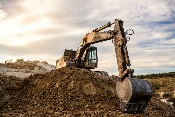 istock The Excavator is digging a construction site hole for future building. 1360827451