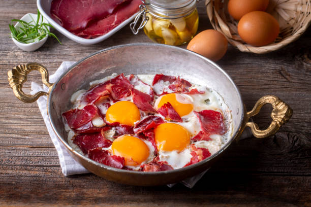 Traditional Turkish food; fried eggs with bacon. Turkish name; Pastirmali yumurta Traditional Turkish food; fried eggs with bacon. Turkish name; Pastirmali yumurta pastrami photos stock pictures, royalty-free photos & images