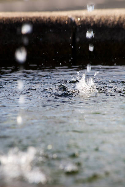 istock Water fountain, two spurts and water surface. 1360832837