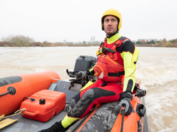 istock Rescue firefighter drives the boat down the river 1360835082