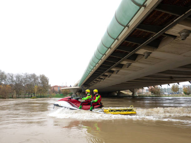 istock two rescuers track the river with the jet ski under the bridge 1360835126