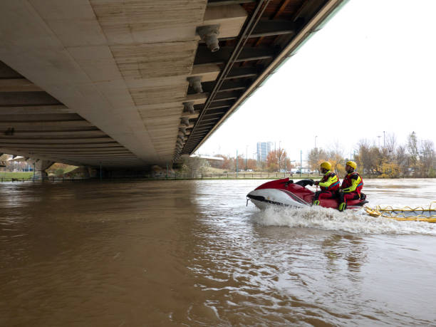 istock two rescuers track the river with the jet ski under the bridge 1360835132
