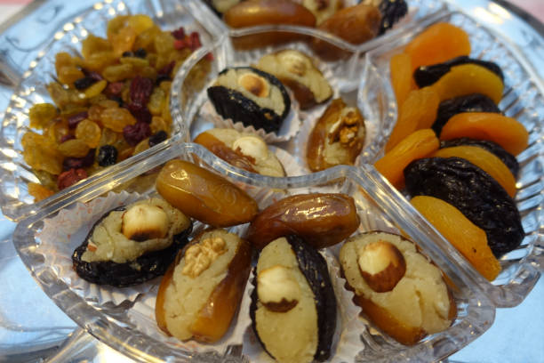 istock Dates and prunes stuffed with almond paste Raisins Nuts  Dessert buffet 1360839594