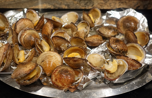 Sea almonds Open shellfish presented on a platter