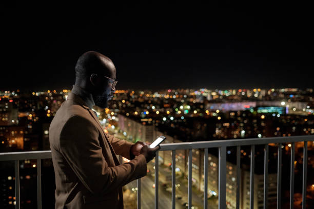 istock Young serious businessman scrolling in smartphone 1360841082