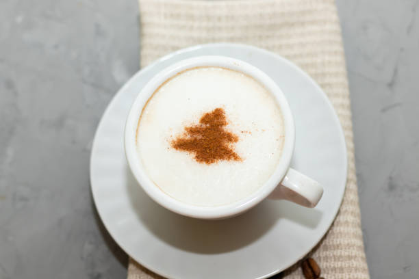 istock cappuccino coffee cup with cinnamon pattern, christmas drink,on concrete background 1360842840