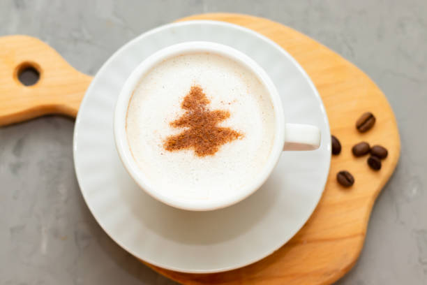 istock cappuccino coffee cup with cinnamon pattern, christmas drink,on concrete background 1360842852