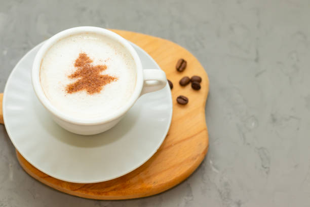 istock cappuccino coffee cup with cinnamon pattern, christmas drink,on concrete background 1360842858