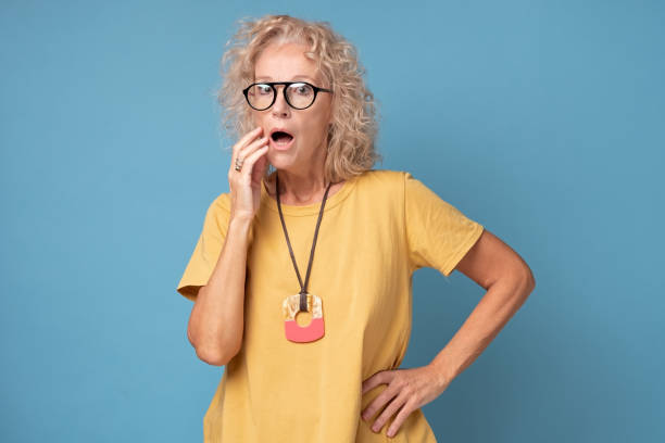 istock An old caucasian blonde lady expresses shock or surprise 1360852035