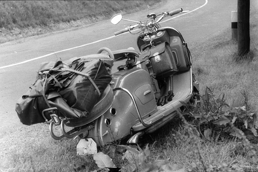 North Rhine Westphalia, Germany, 1956. Break at the roadside. Traveling by scooter.