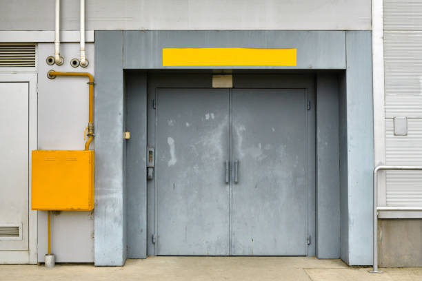istock Old industrial warehouse door 1360852939