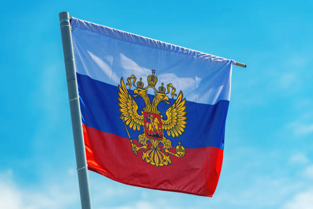 istock Russian flag with the coat of arms, two-headed eagle without the shield 1360852942
