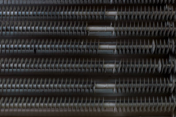 istock Threaded metal pipes, part of an industrial cooling system, close-up. 1360854720