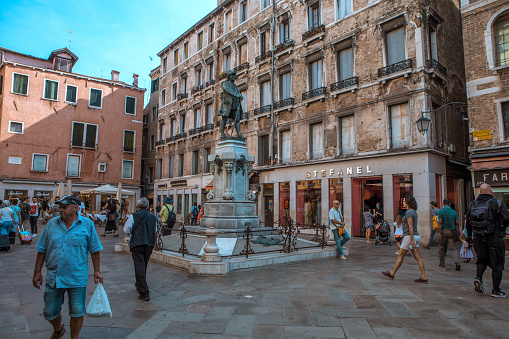Venice, Italy - September 09th, 2021: Tourists and locals in the streets as the stores start to reopen in the centre of Venice during the easing of the corona virus lockdown in the Autumn of 2021 in the centre of Venice, Italy