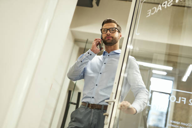 istock Confident boss entering the office and calling someone 1360856025
