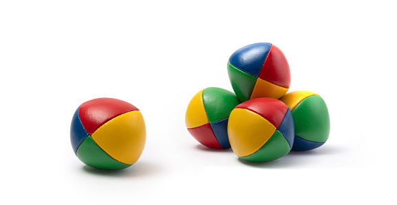 Colorful juggling balls - against a white background