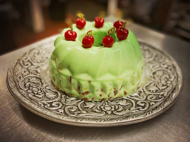 Green Gelatin topped with Maraschino Cherries