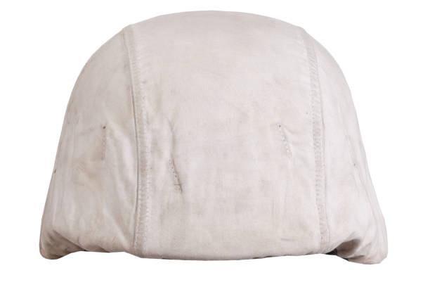 istock German army helmet with white camouflage cover, type winter. Isolated on white background 1360872043