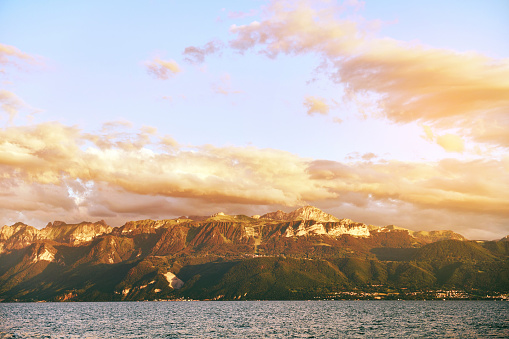 Sunset over lake Geneva (Lac Leman), view of Haute-Savoie, Auvergne-Rhone-Alpes region. Image taken in Ouchy, Lausanne, Switzerland