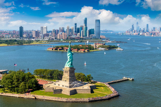 Statue of Liberty n New York Panoramic aerial view Statue of Liberty and Jersey City and Manhattan cityscape in New York City, NY, USA new york stock pictures, royalty-free photos & images