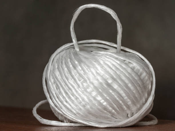 a ball of polypropylene strong rope for crafts or bundling of bundles, one turn raised up, - nylon strings imagens e fotografias de stock