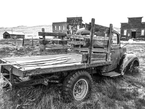 A vintage truck sits among the landscape of the ghost town of Bodie. That has been turned into a state historical park in California