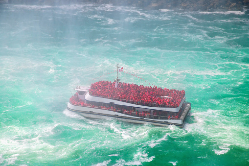 Tourists on board ferry in the Niagara river at Niagara falls, USA