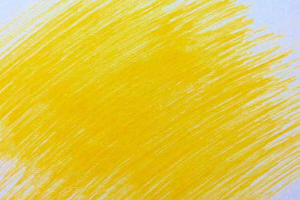 Yellow color pencil scribbles background texture stock photo