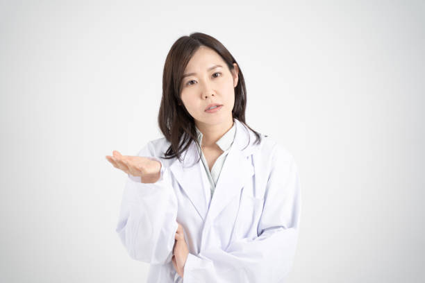 istock Image of a female doctor explaining online medical treatment through a computer screen White background 1360921962