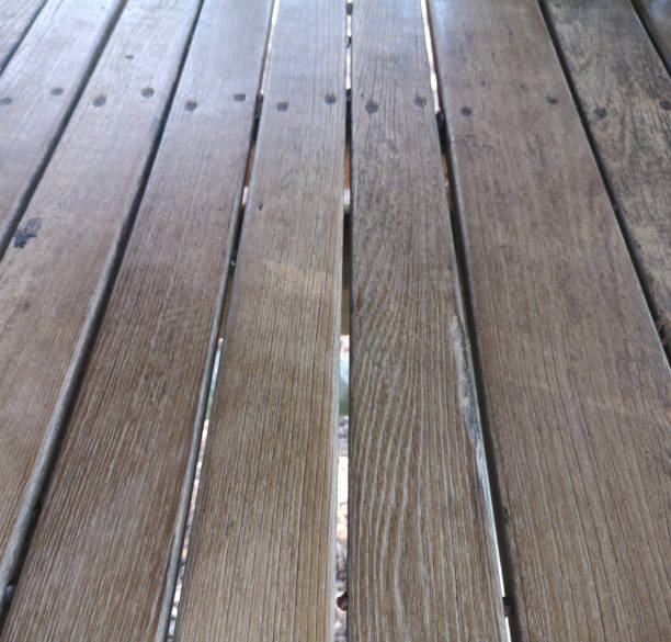istock wooden board corroded by the time used used 1360924598