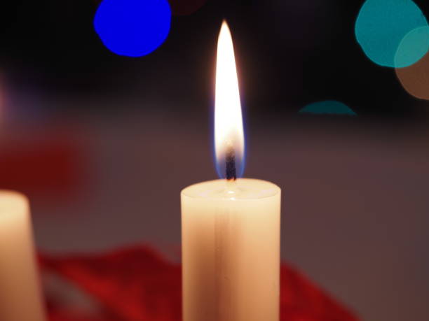 istock Christmas candles on the table 1360928026