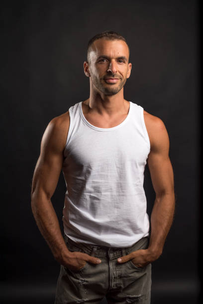 istock Athletic man in casual clothes. Studio shot. 1360928753