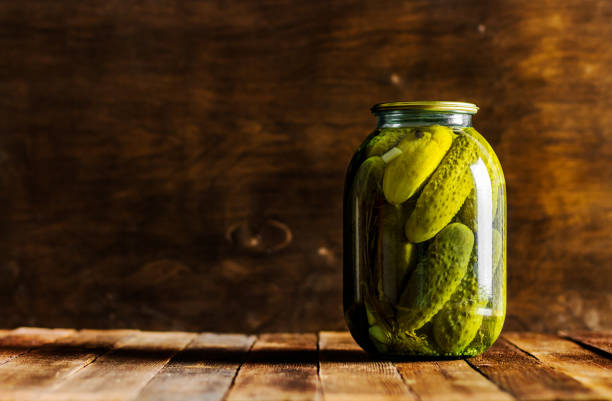 istock pickled cucumbers on a wooden background in a rustic style in glass 1360928859