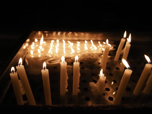 istock church votive candles white flames 1360929783