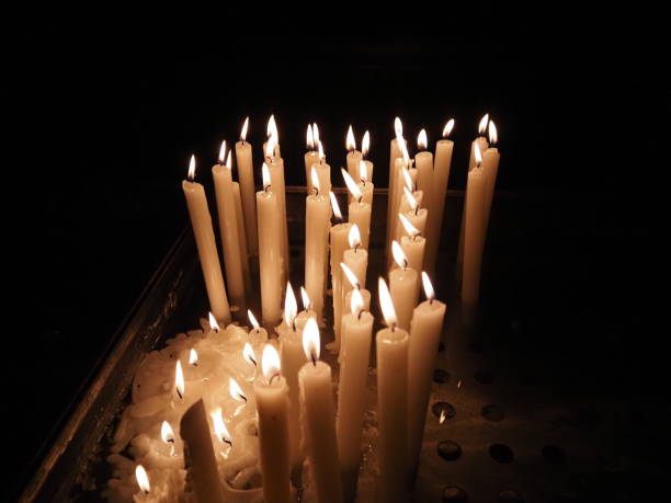 istock church votive candles white flames 1360929804