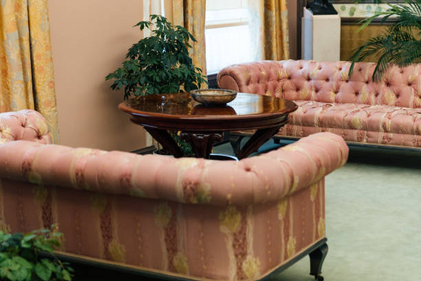 istock interior of the room with a table and peach-colored sofas 1360931852