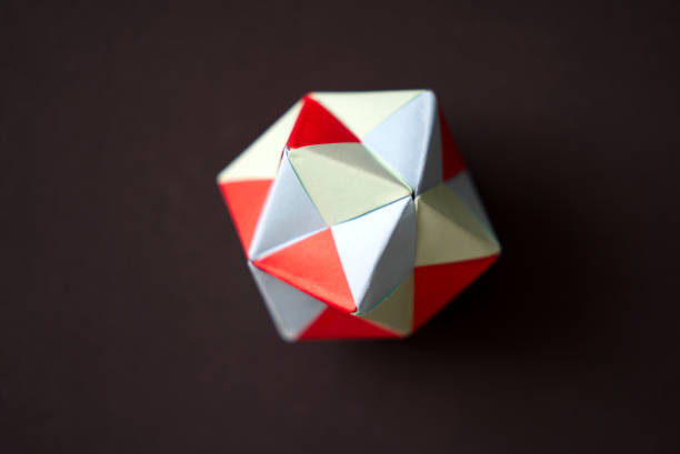 istock Self-made colorful origami star cube against black background. 1360933115